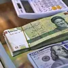 الريال الإيراني أمام الدولار