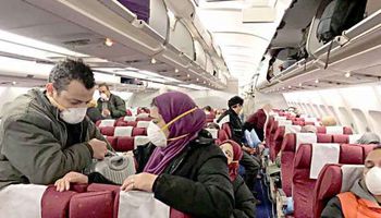 المصريين العائدون من الصين من داخل الطائرة المخصصة لإجلائهم