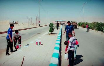 أطفال هوكي الصعيد بقنا يشاركون في تجميل شوارع نقادة