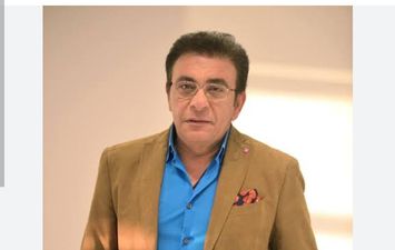 الإعلامي الراحل عاطف كامل 