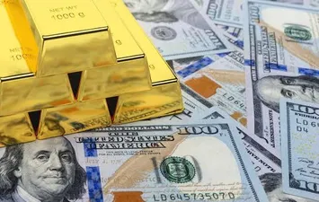 العلاقة بين االدولار والذهب 