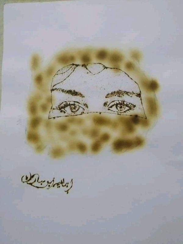 طالب  يرسم  بالنار 